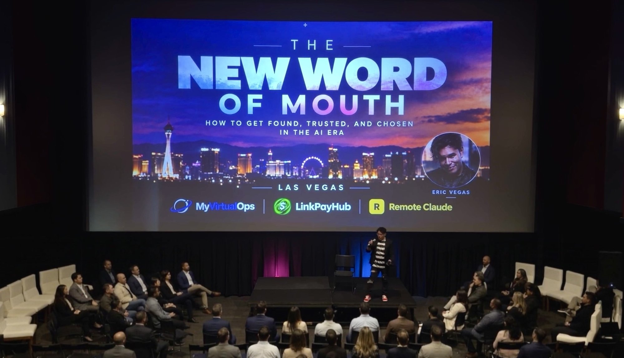 Eric Vegas on stage at Tech Alley Las Vegas in front of a seated audience, with the title slide reading The New Word of Mouth projected behind him